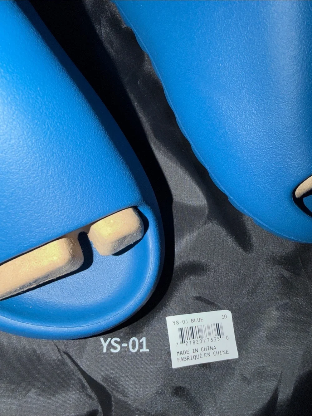 foam runner/slides inspired by Yeezy‎ designs. The bag says “YS-01,”